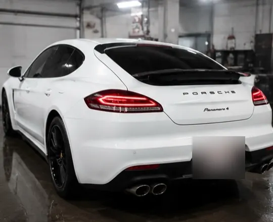 The finished Panamera from the rear, plate blurred